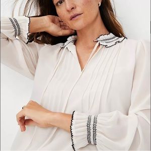 Mixed media ruffle neck pleated yoke top